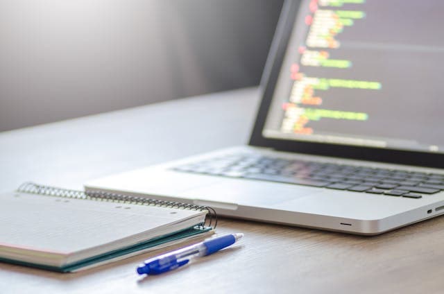 Laptop and notepad photo